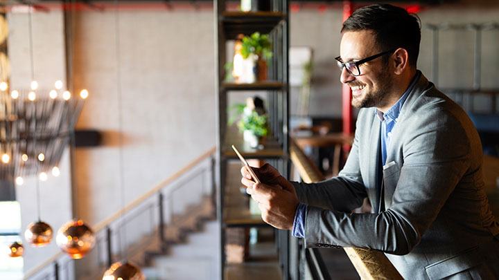720_0000_young-business-man-using-a-digital-tablet-at-offic-6J25YFD